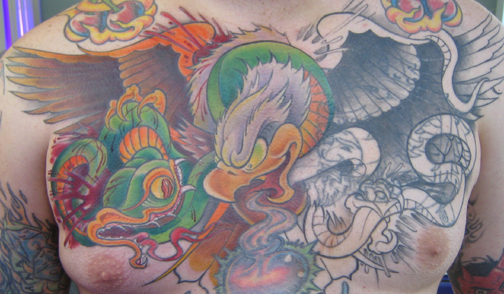 Looking for unique  Tattoos? eagel and snake cover up tattoo